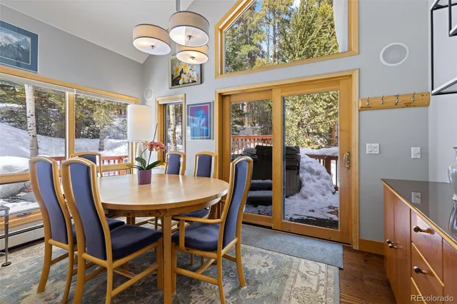 a view of a dining room that has a table and chairs