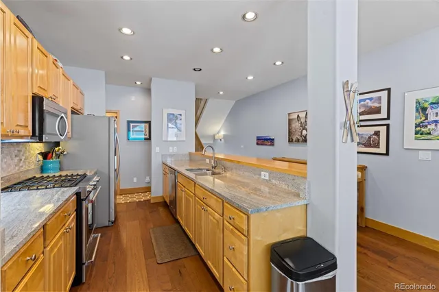 a kitchen with a stove and a refrigerator