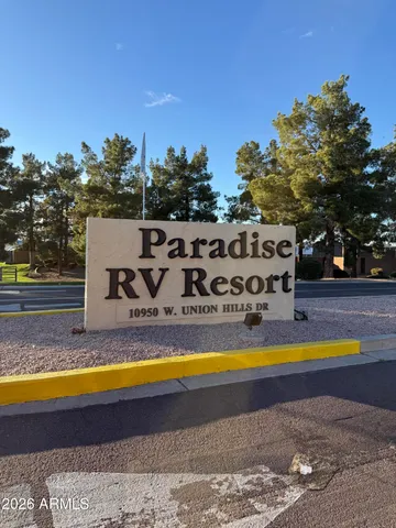 a view of swimming pool with trees in the background