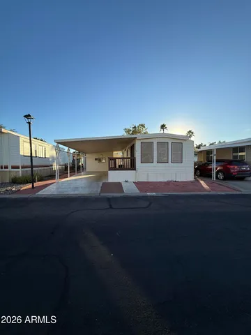 a view of house with yard and street view