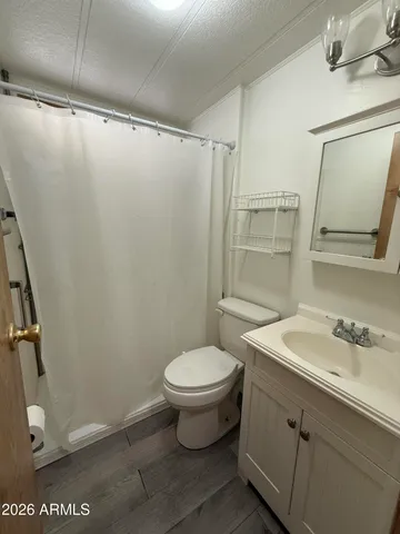 a white toilet sitting next to a bathroom sink