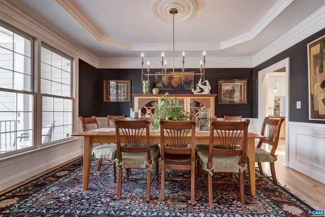 a living room with furniture wooden floor and a fireplace