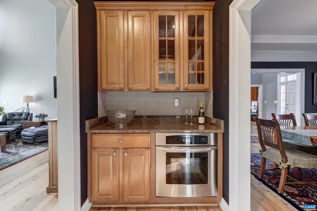 a kitchen with stainless steel appliances granite countertop a refrigerator sink and stove