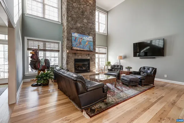 a kitchen with granite countertop white cabinets appliances and a sink