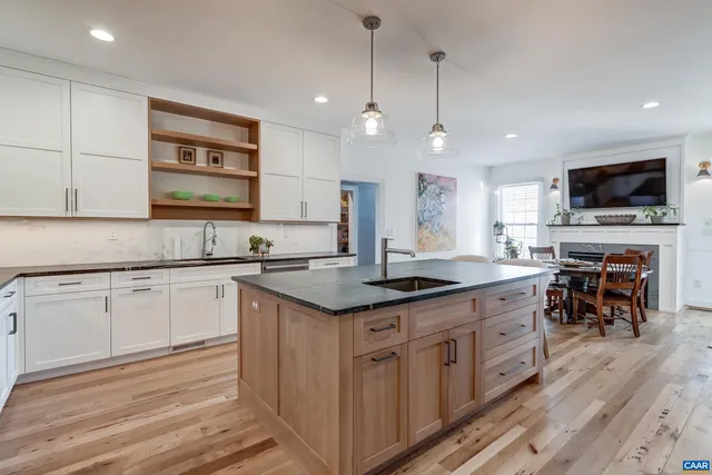 a utility room with sink dryer and washer