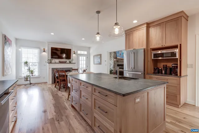 a spacious bathroom with a double vanity sink double mirror and bathtub