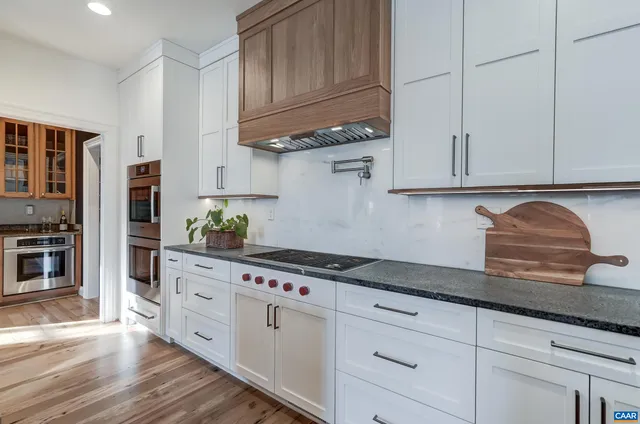 a bathroom with a bathtub and window