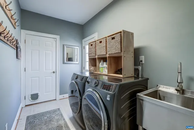 a view of a hallway with wooden floor and stairs