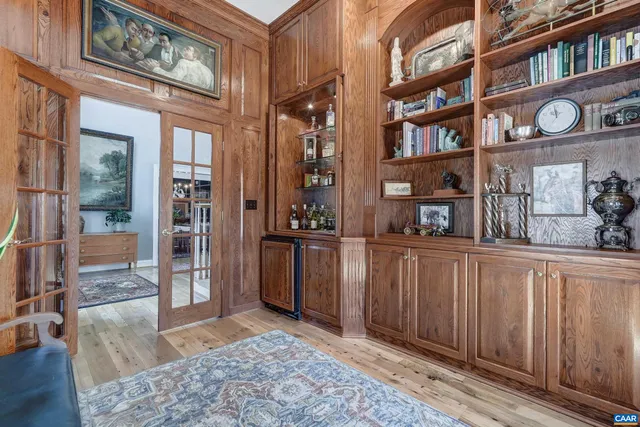 a bed room with a bed and a chair