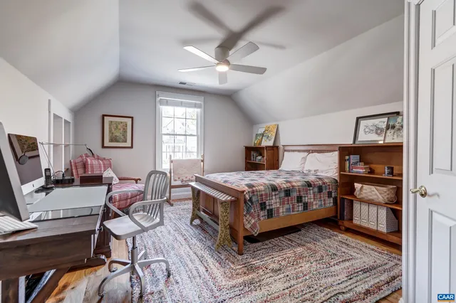 a bathroom with a sink a toilet a mirror and shower