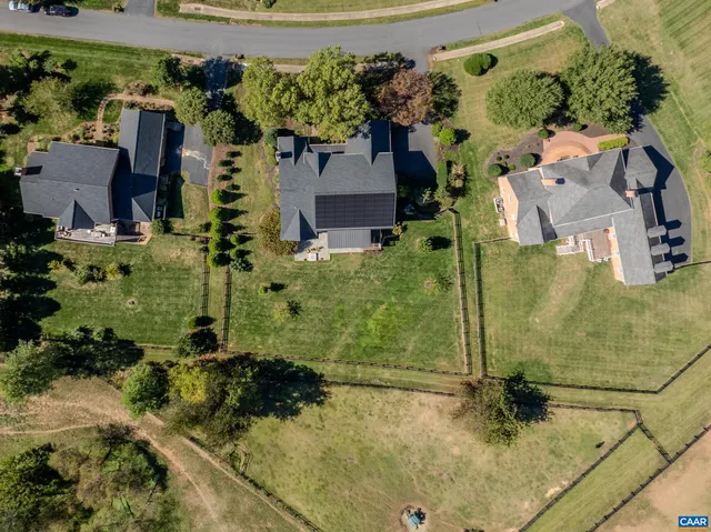 a view of a patio with table and chairs and potted plants