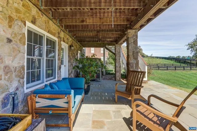a view of staircase with wooden floor and a rug