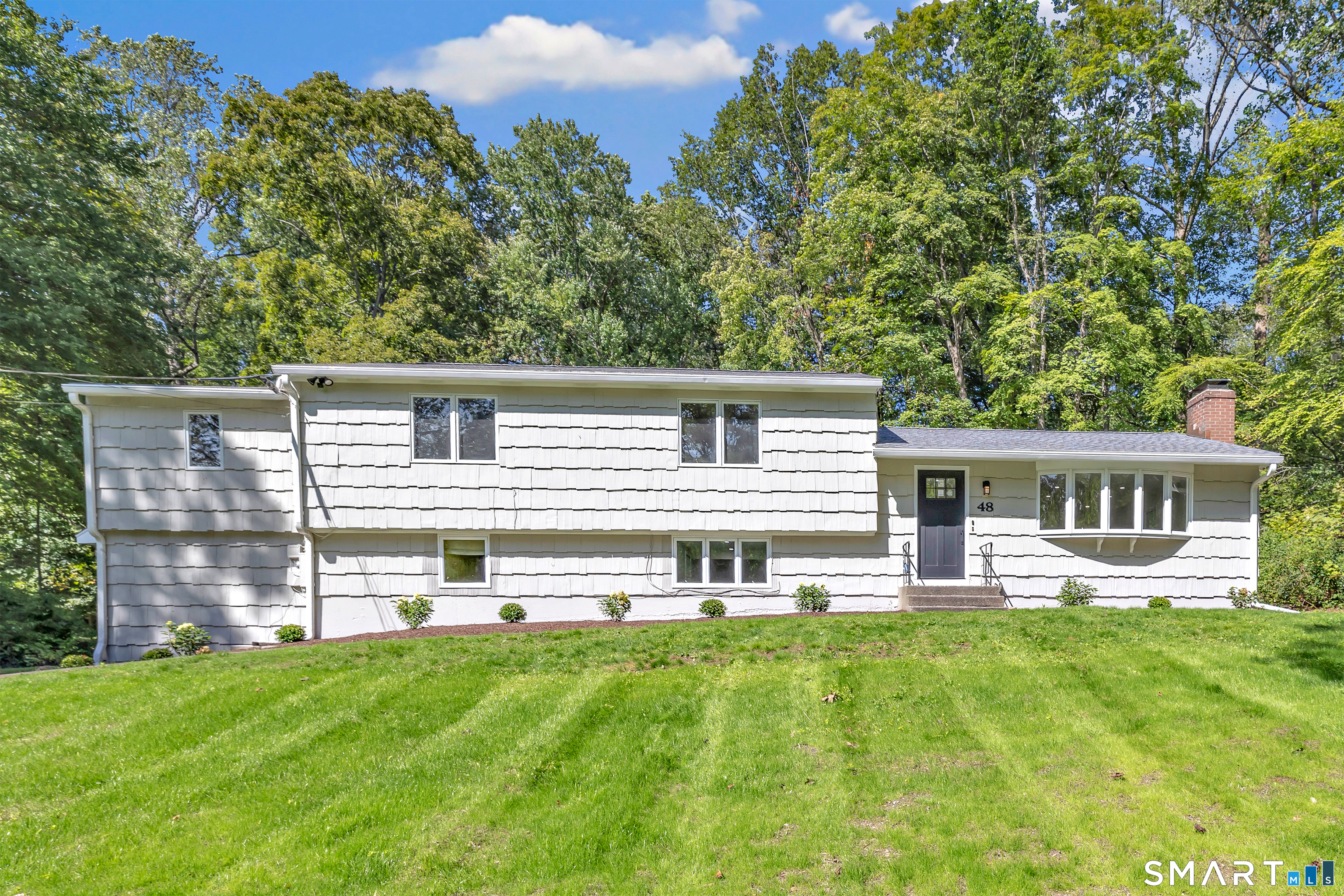 48 Crestwood Road Monroe, CT 06468 - Photo 2 of 32 front view of a house with a yard