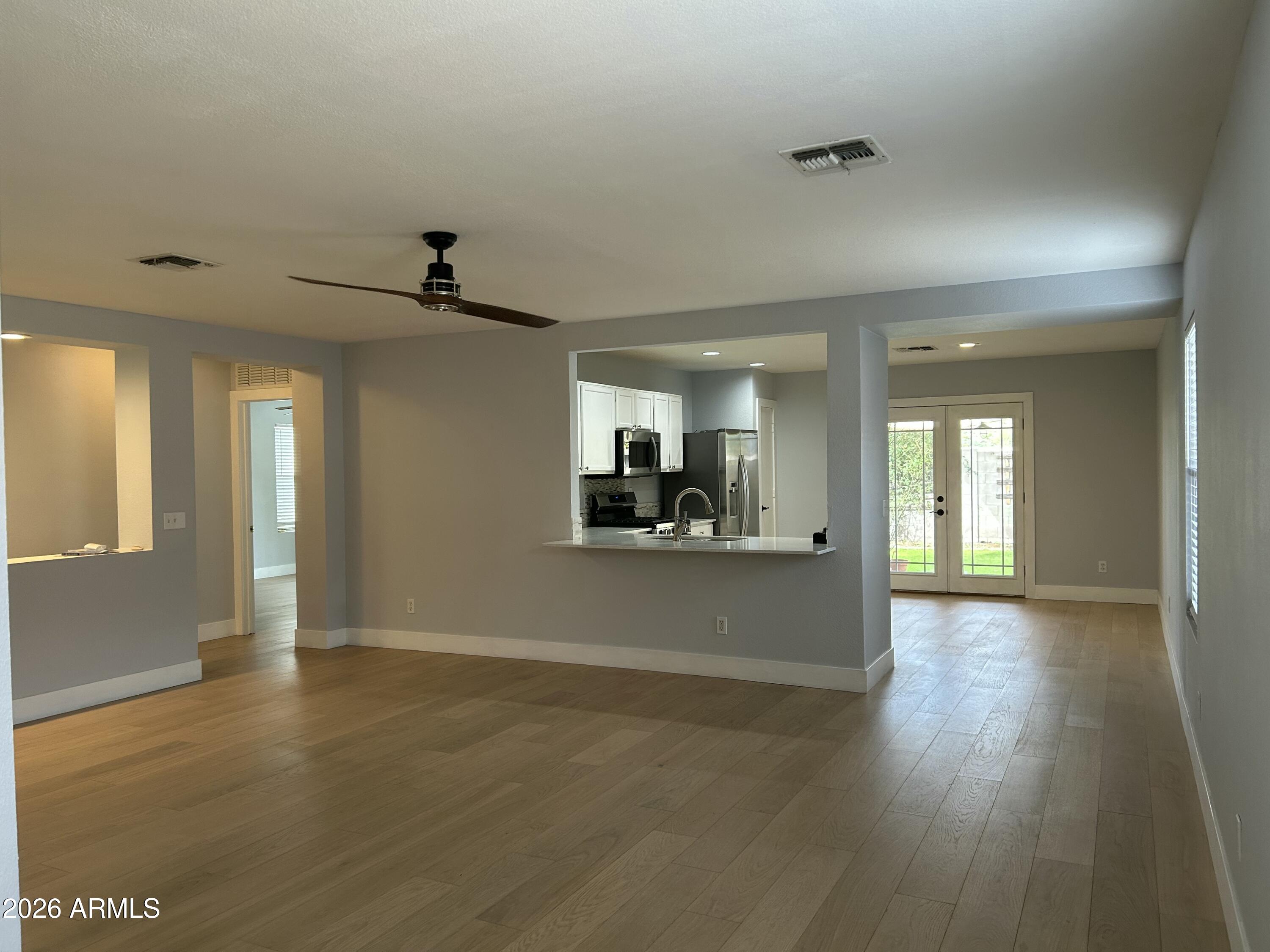 3216 West Mark Lane Phoenix, AZ 85083 - Photo 3 of 23 a view of empty room with wooden floor