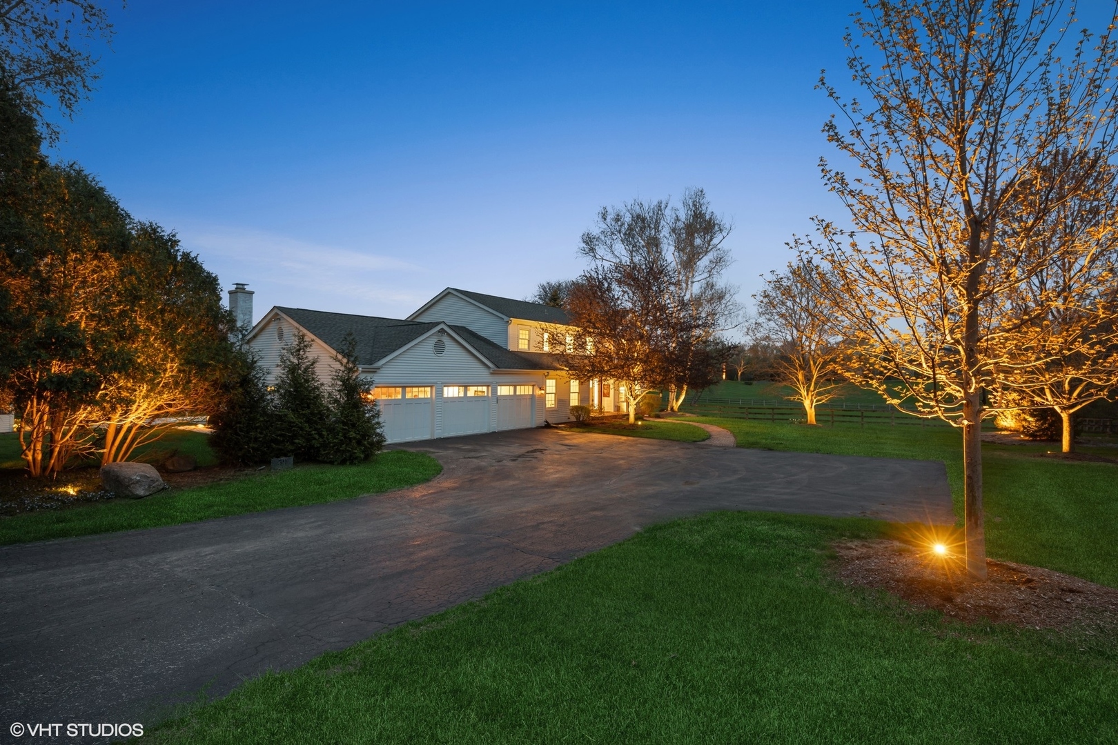 a view of a yard with a house in the background