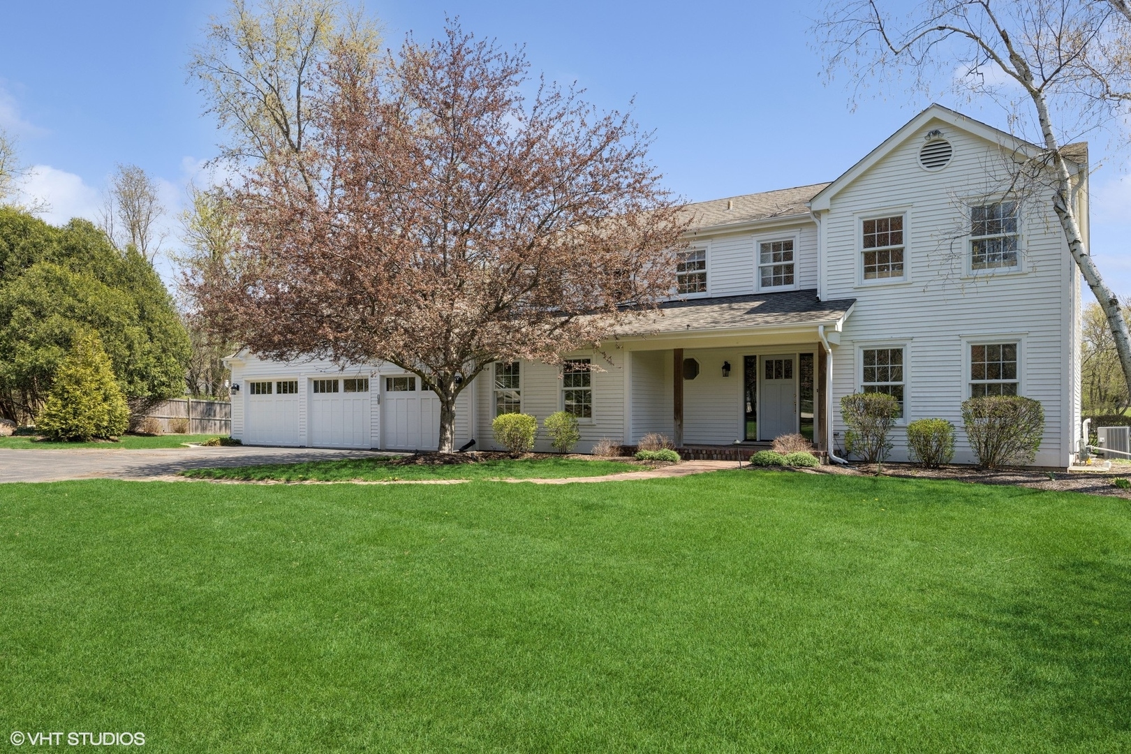 59 Ridge Road Barrington Hills, IL 60010 - Photo 2 of 44 a front view of a house with a garden