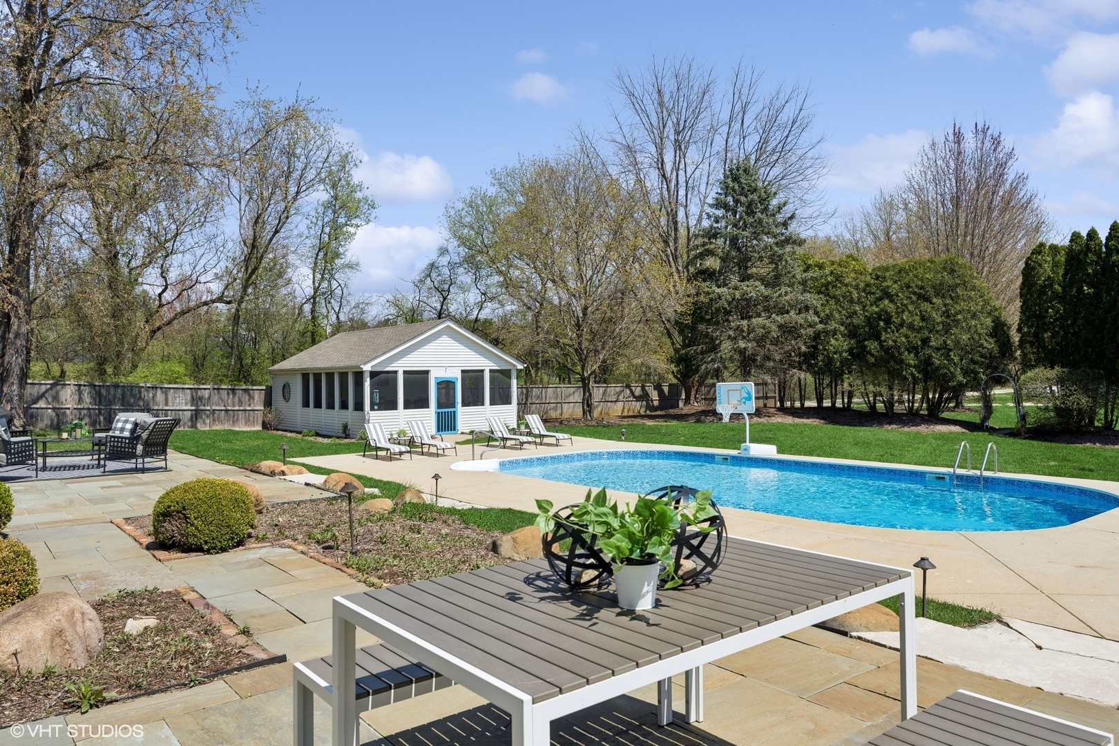 59 Ridge Road Barrington Hills, IL 60010 - Photo 30 of 44 a view of a swimming pool with lounge chairs in the patio