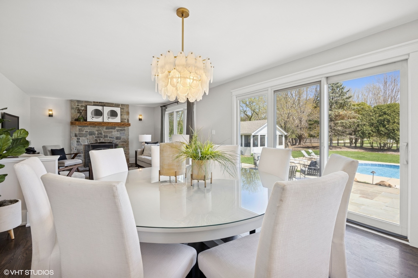 59 Ridge Road Barrington Hills, IL 60010 - Photo 10 of 44 a view of a dining room with furniture a chandelier and wooden floor