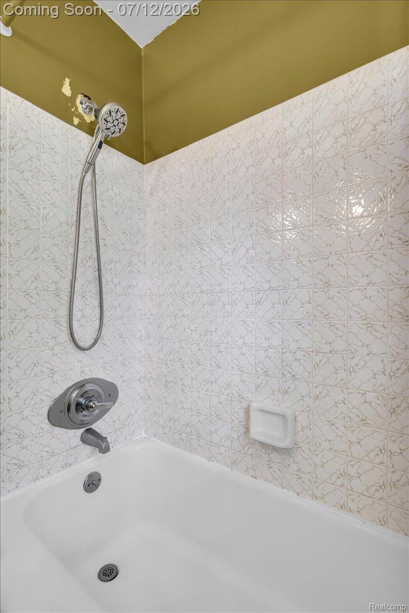 624 North Prospect Road Ypsilanti, MI 48198 - Photo 12 of 28 Bathtub and shower combination featuring a chrome shower head and faucet