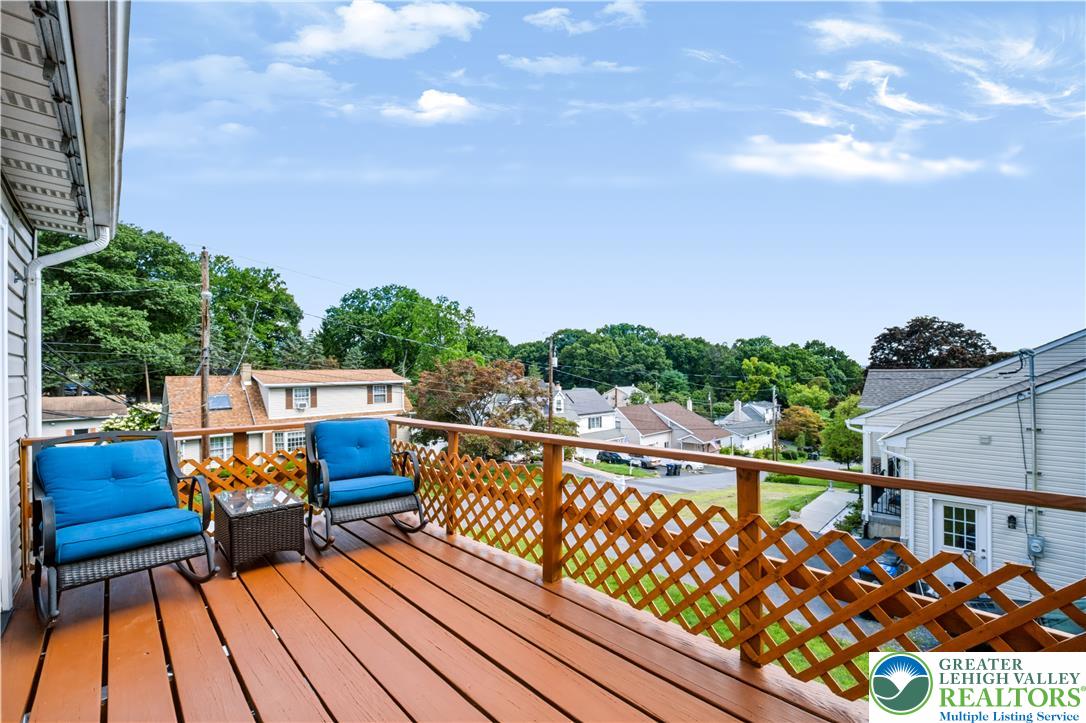 1764 Ritter Street Bethlehem, PA 18015 - Photo 12 of 29 An elevated wood deck overlooks the surrounding neighborhood trees and rolling blue skies.