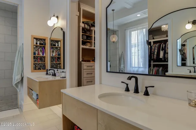 a white bath tub sitting next to a white sink