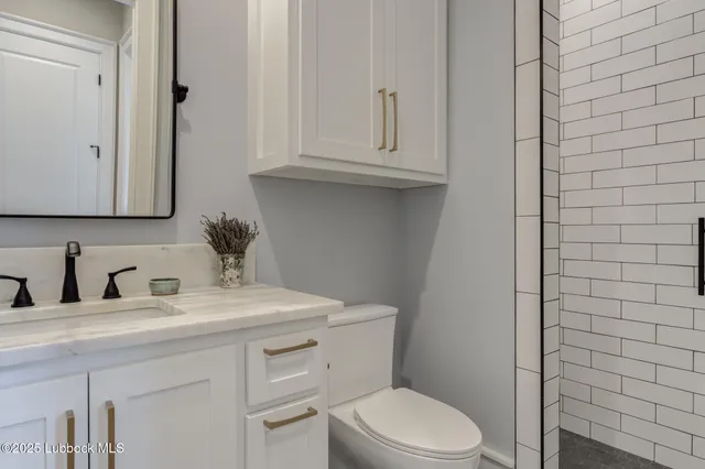 a room with a chair and a flat screen tv