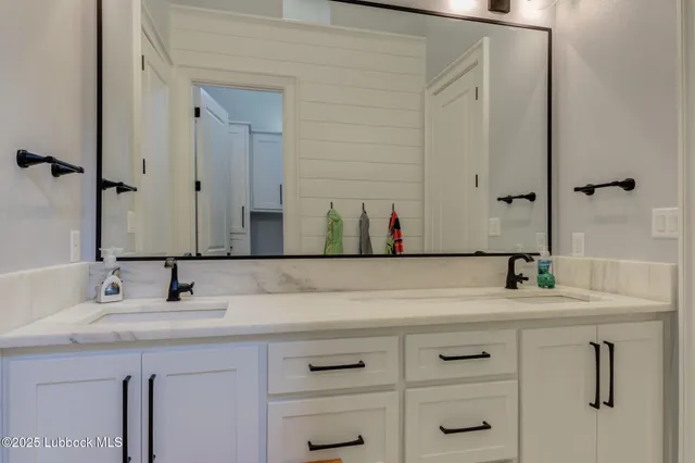 a bedroom with a bed and a desk