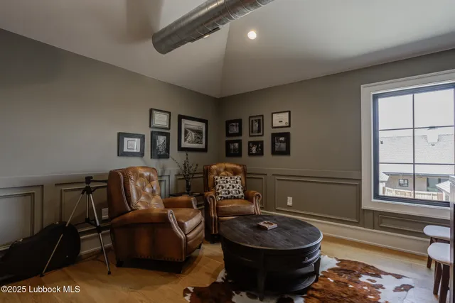 a backyard of a house with barbeque oven and outdoor seating