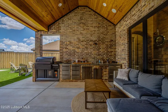 a view of a chairs and table in the patio