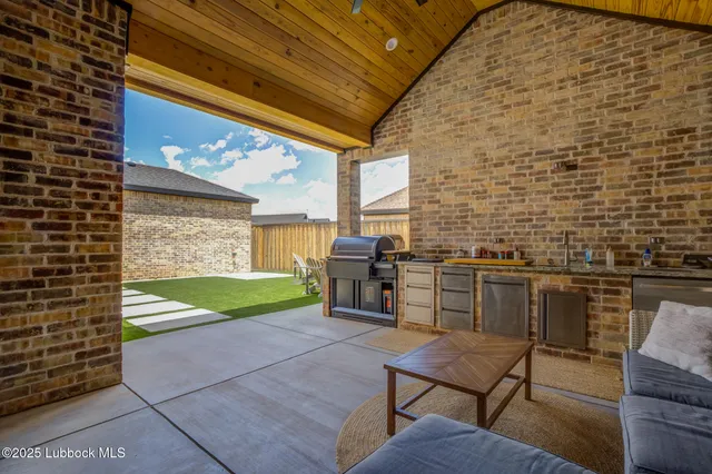 a view of a house with backyard porch and sitting area