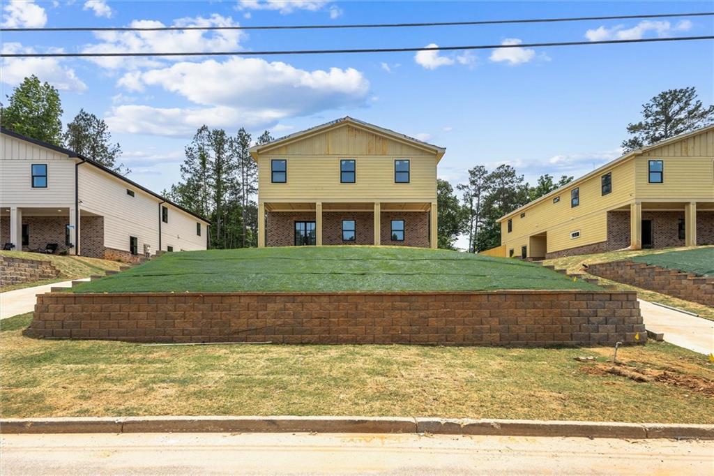 6848 Silver Maple Drive Rex, GA 30273 - Photo 1 of 38 a view of a house with a yard