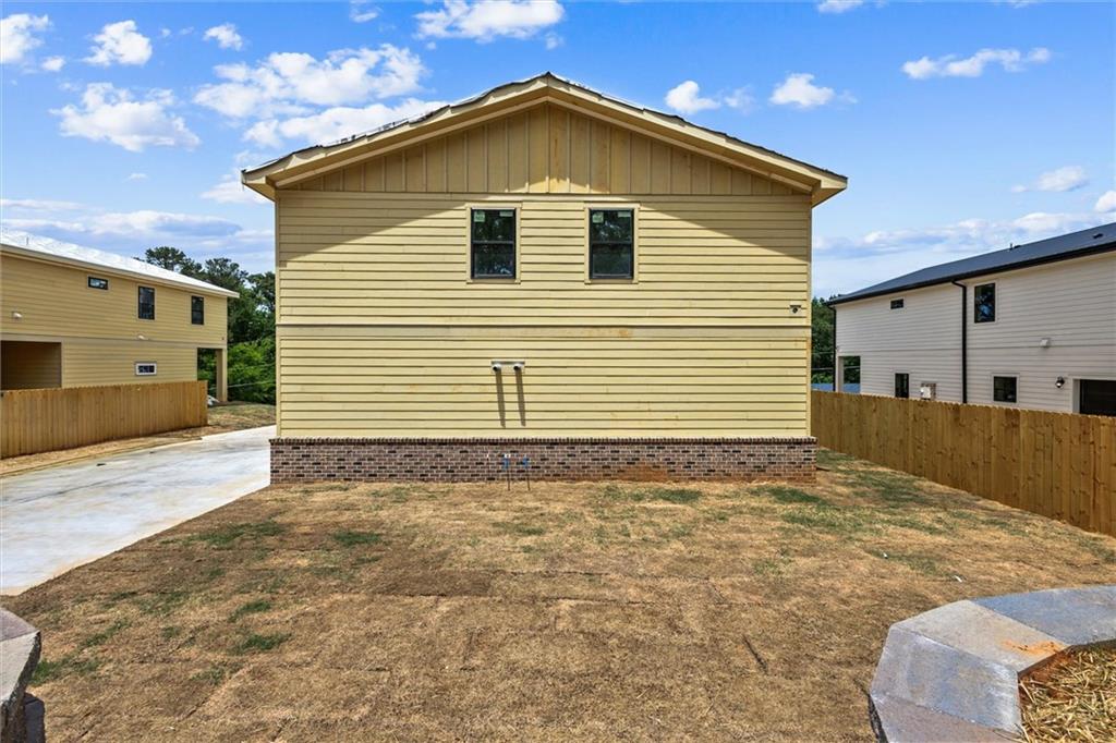 6848 Silver Maple Drive Rex, GA 30273 - Photo 2 of 38 a view of a backyard of a house