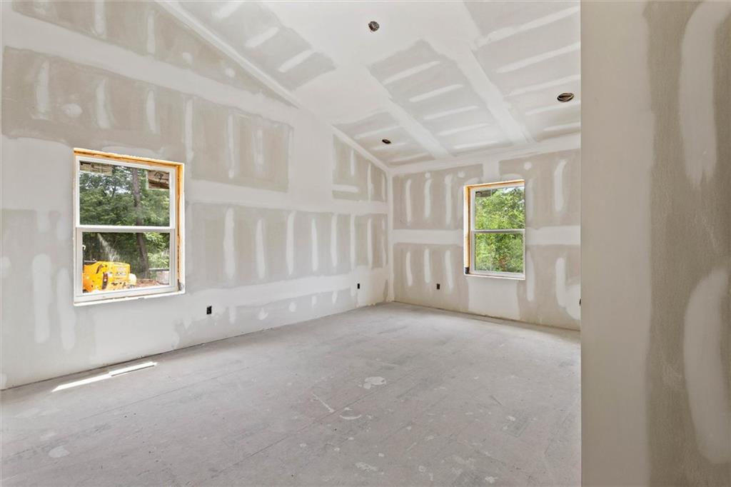 6848 Silver Maple Drive Rex, GA 30273 - Photo 30 of 38 an empty room with windows and closet