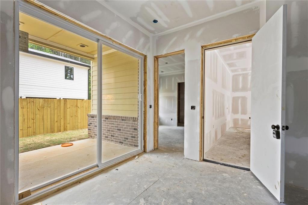 6848 Silver Maple Drive Rex, GA 30273 - Photo 6 of 38 a view of a bathroom with a glass door