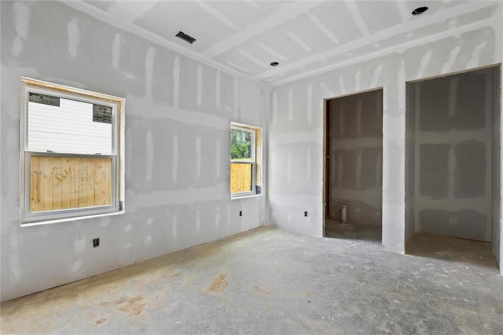 6848 Silver Maple Drive Rex, GA 30273 - Photo 7 of 38 an empty room with windows and closet