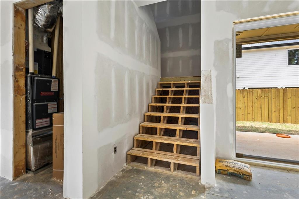 6848 Silver Maple Drive Rex, GA 30273 - Photo 8 of 38 a view of an empty room with wooden floor and windows