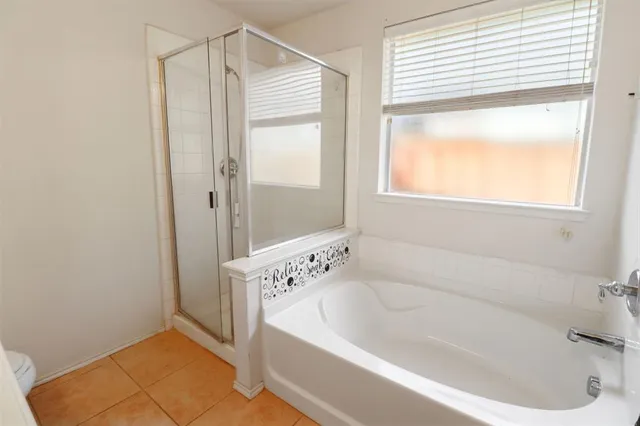 a white bath tub sitting next to a window