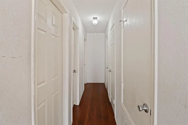 a view of a bathroom from a hallway