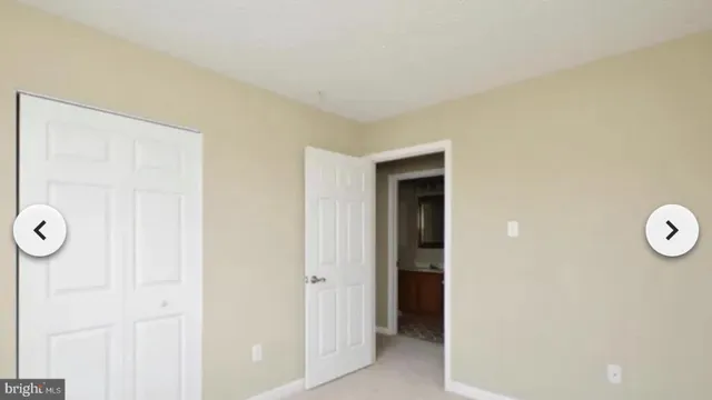 an empty room with mirror