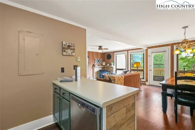 a view of kitchen island a sink and living room