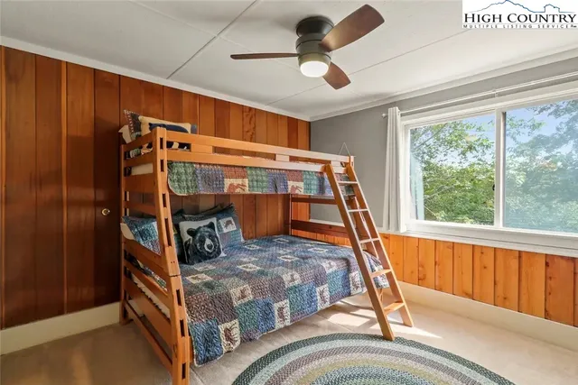 a bedroom with furniture and a window