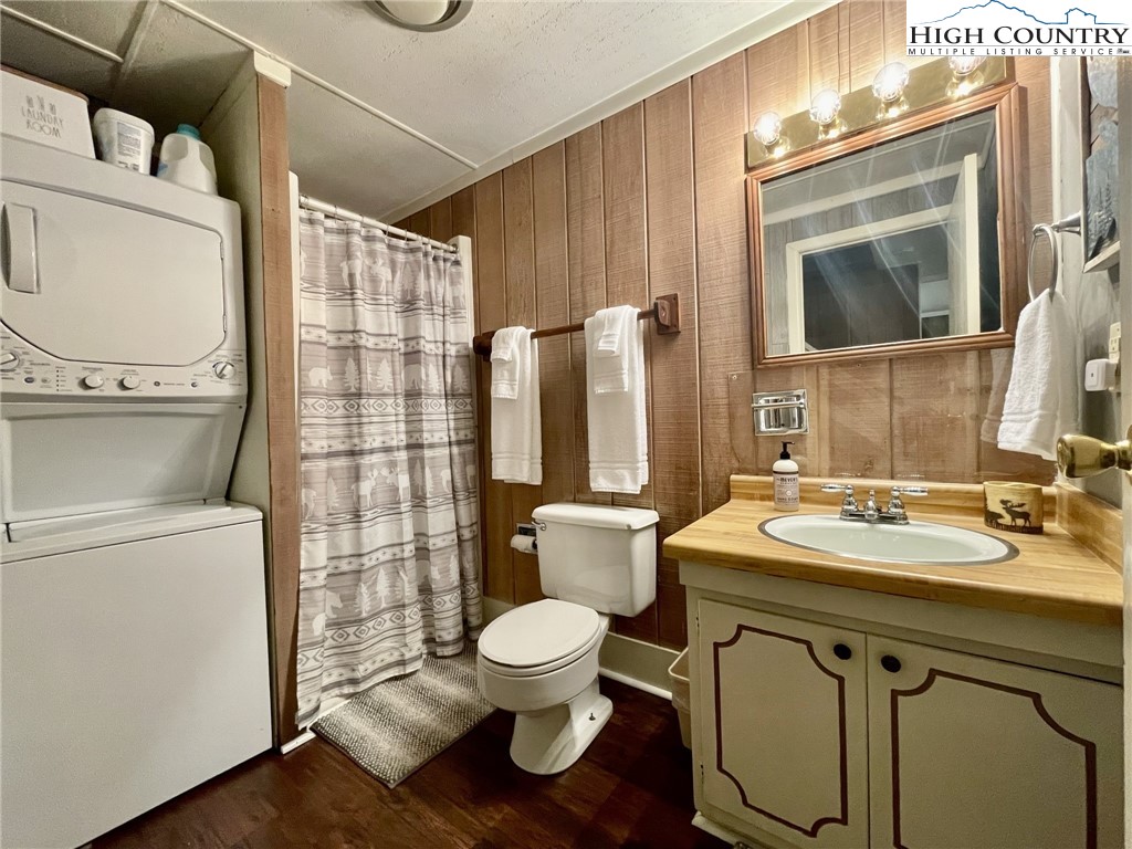 220 Charter Hills Road, Unit B1 Beech Mountain, NC 28604 - Photo 17 of 26 a bathroom with a toilet a sink and a mirror