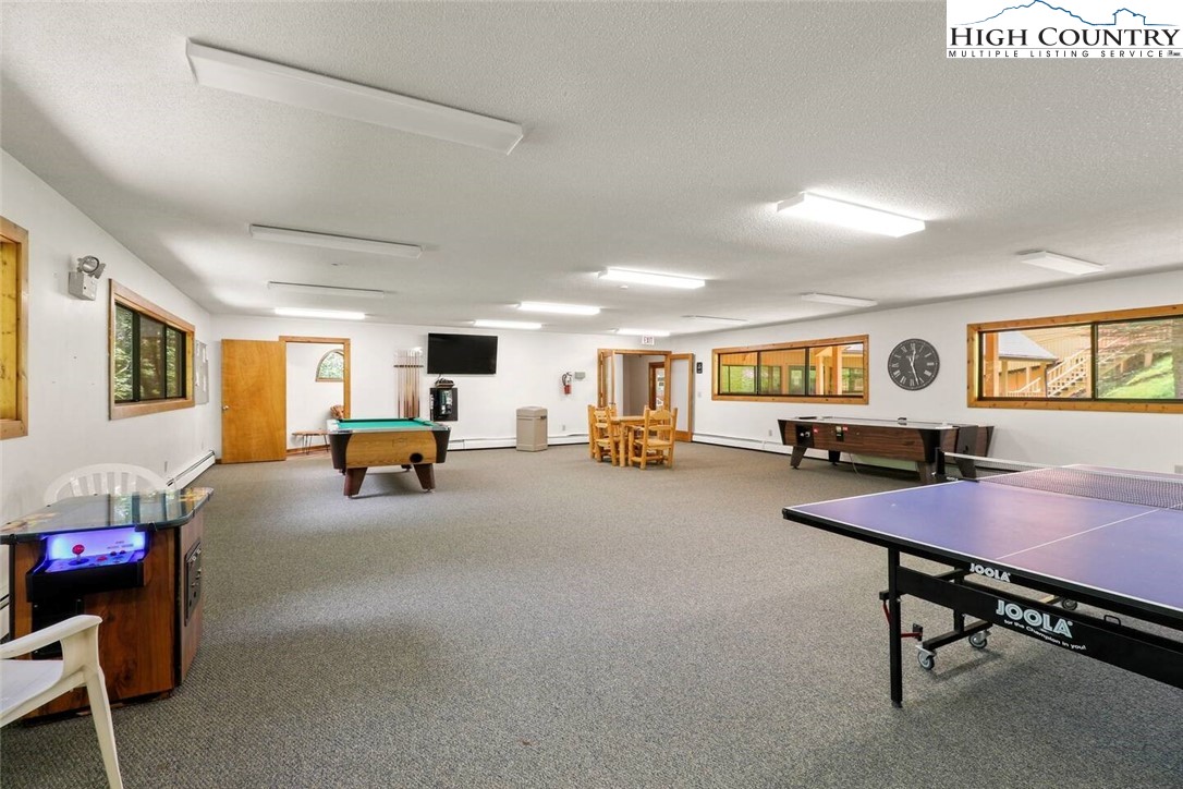220 Charter Hills Road, Unit B1 Beech Mountain, NC 28604 - Photo 25 of 26 a living room with furniture and a table