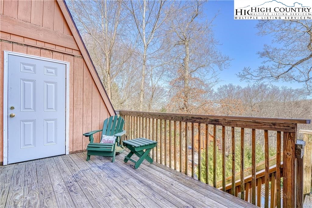220 Charter Hills Road, Unit B1 Beech Mountain, NC 28604 - Photo 26 of 26 a view of balcony with wooden floor and outdoor seating
