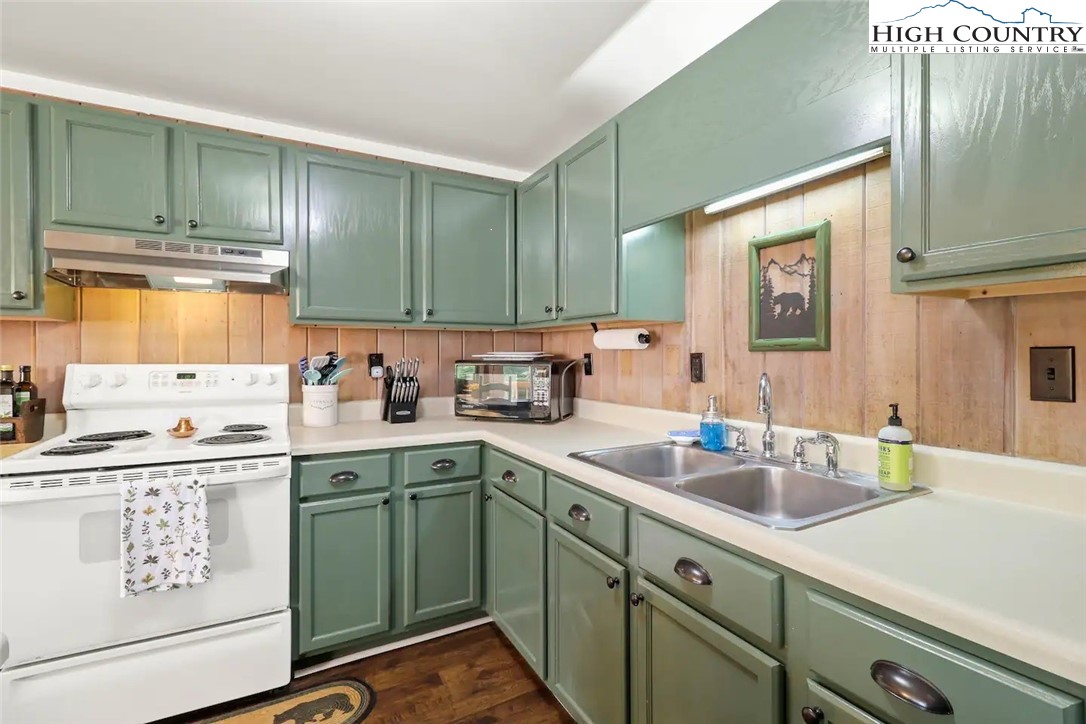 220 Charter Hills Road, Unit B1 Beech Mountain, NC 28604 - Photo 9 of 26 a kitchen with a sink cabinets and window