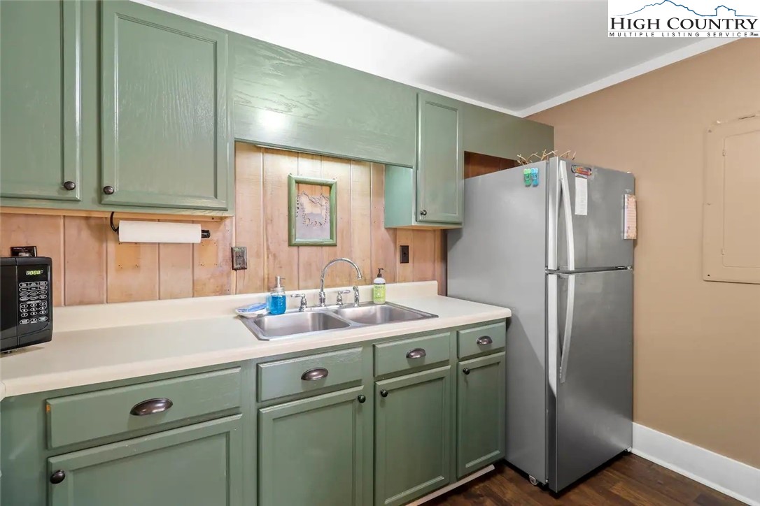 220 Charter Hills Road, Unit B1 Beech Mountain, NC 28604 - Photo 10 of 26 a kitchen with a refrigerator and a sink
