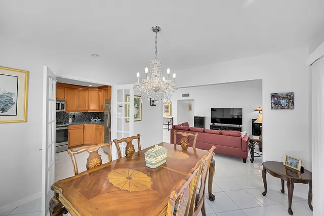 a kitchen with stainless steel appliances granite countertop a sink a stove and cabinets