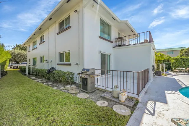 a view of a swimming pool with a seating space