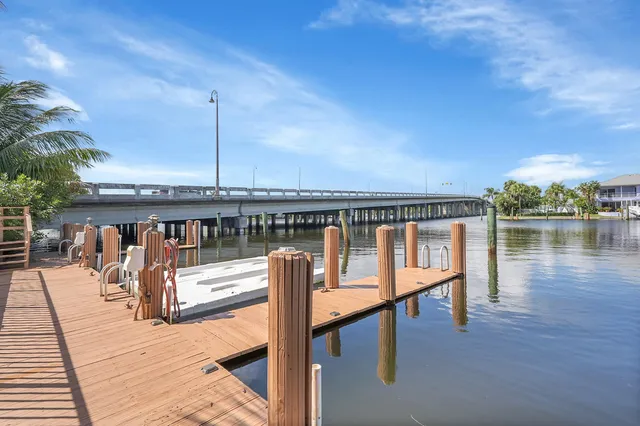 an aerial view of a house with a swimming pool outdoor seating and yard