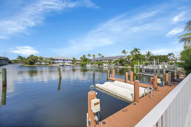 an aerial view of a house with yard swimming pool and outdoor seating